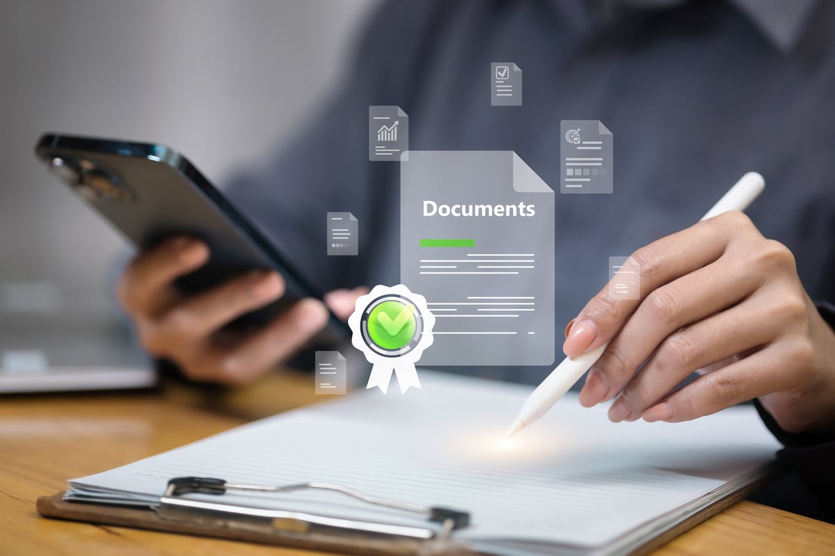 Businesswoman verifying digital documents using smartphone and stylus, with secure e-signature and approval icon, in modern paperless workflow.